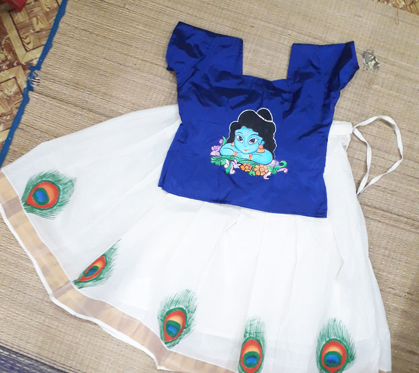 Cute Krishna face hand mural painting on blue kerala pattu pavada
