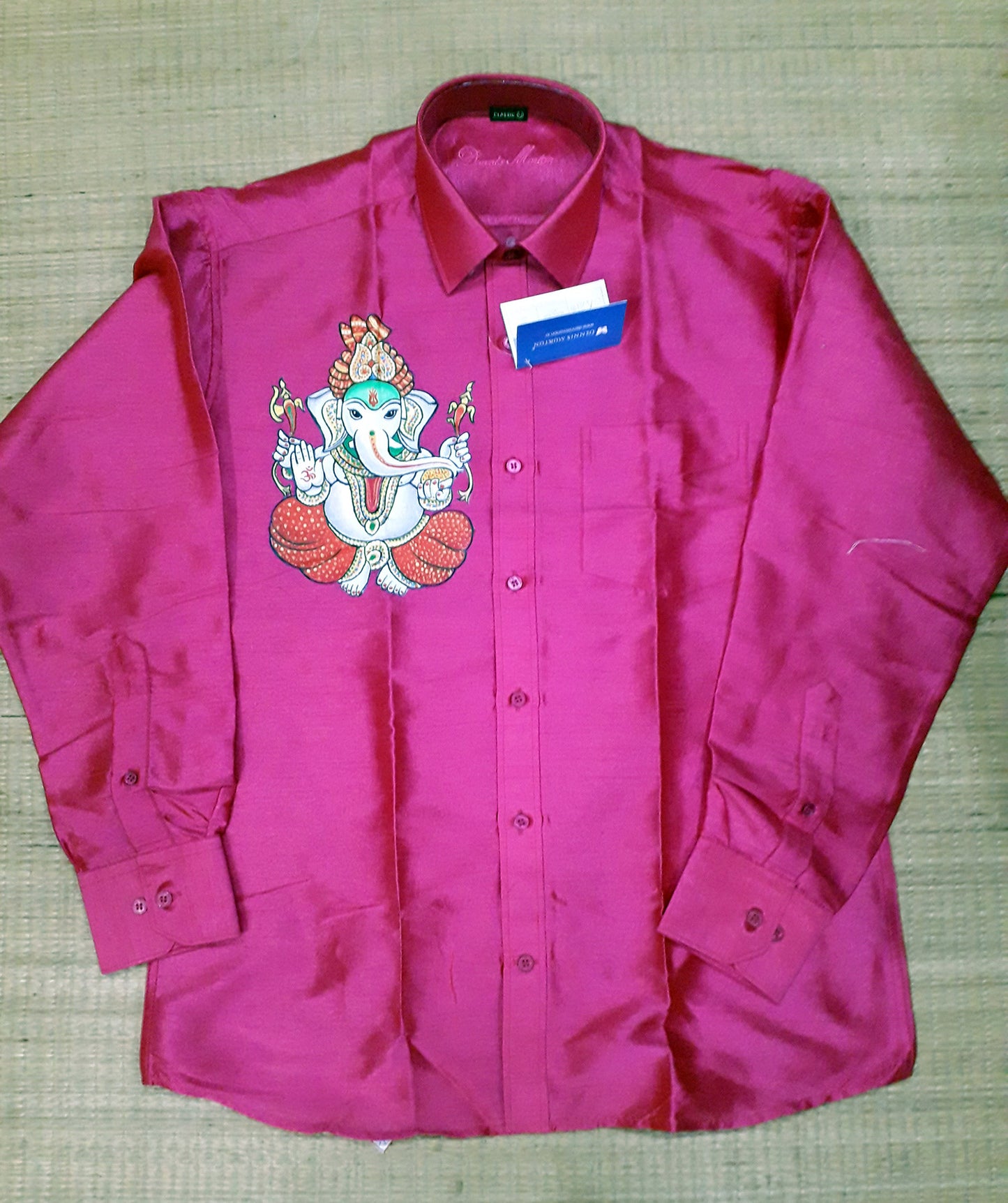 White ganapathy hand mural painting on pink silk shirt