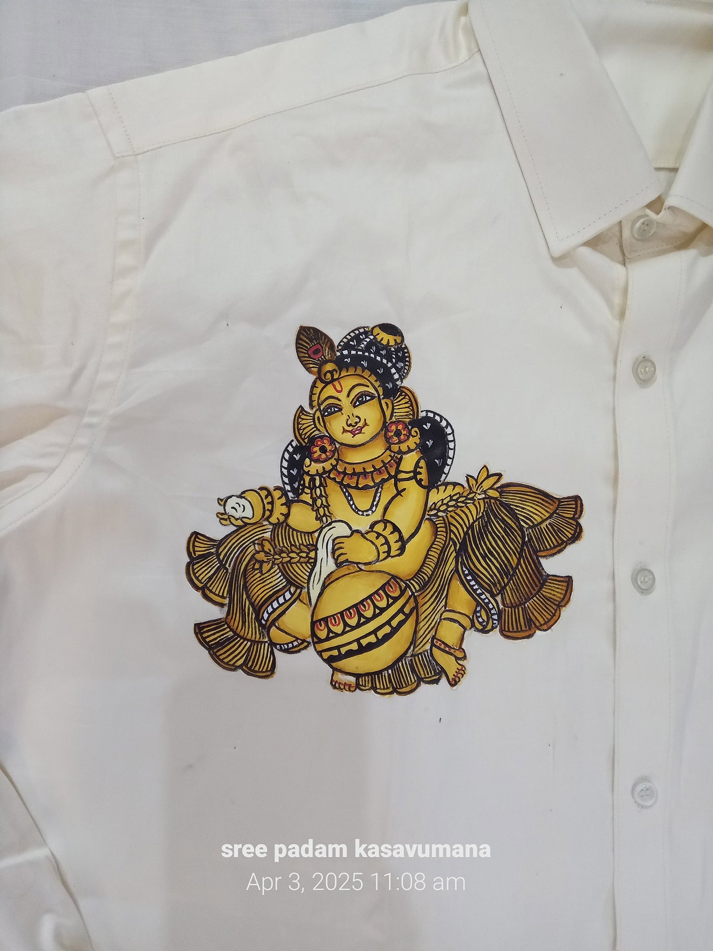 Golden krishna hand mural painting on cream silk shirt