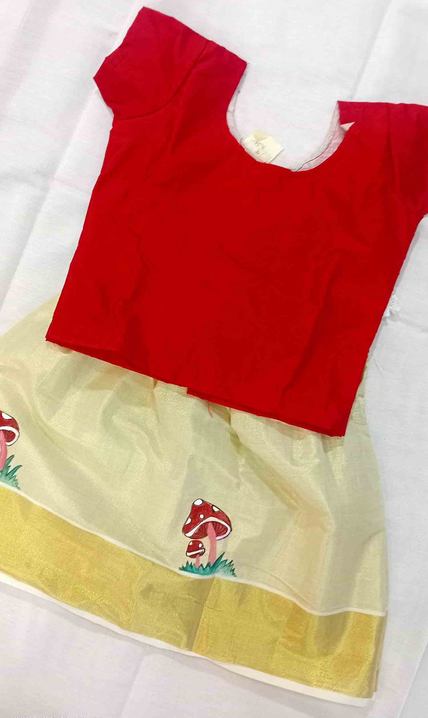 Mushroom design hand mural kerala tissue pattu pavada with red blouse for kids