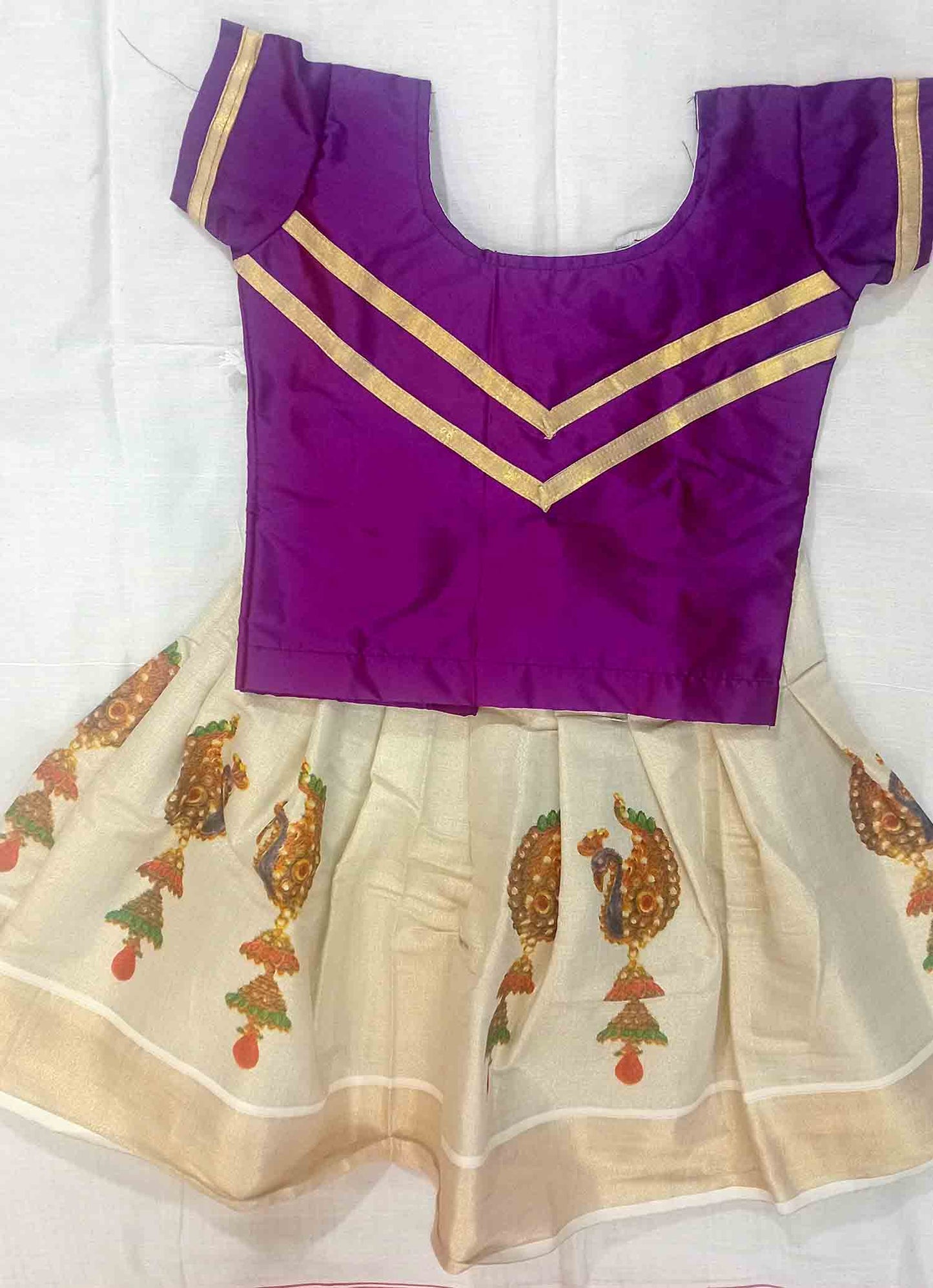 Peacock printed design kerala tissue pattu pavada with purple blouse