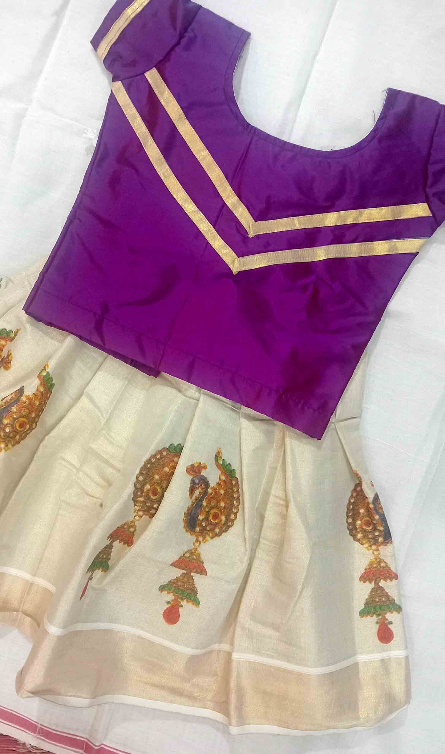 Peacock printed design kerala tissue pattu pavada with purple blouse