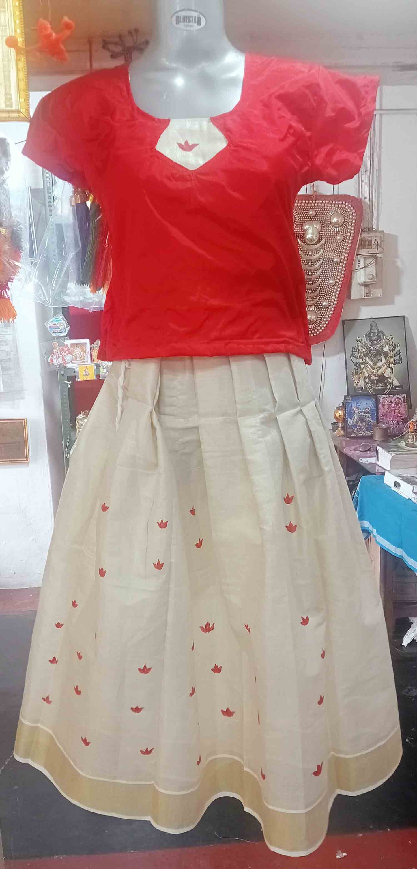 Red flower kerala tissue kasavu pattu pavada with red blouse for women