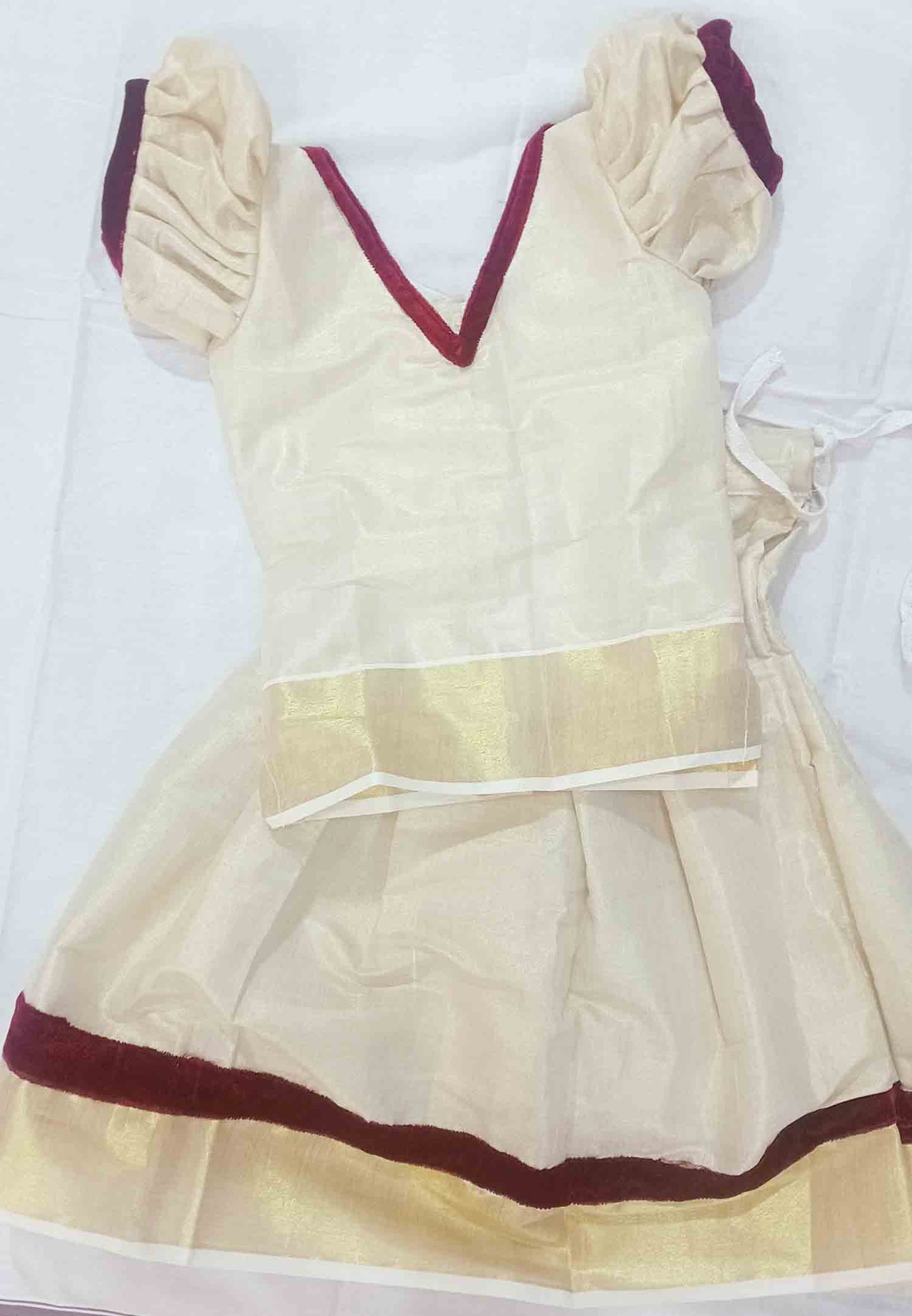 Kerala tissue pattu pavada with maroon velvet border for kids