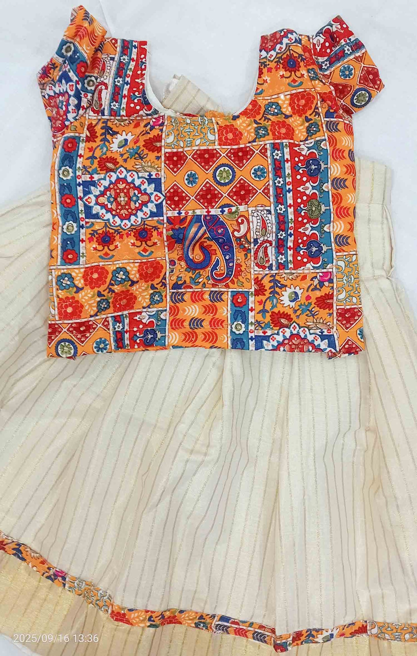Line design kerala tissue kids pattu pavads with kalamkari border and blouse