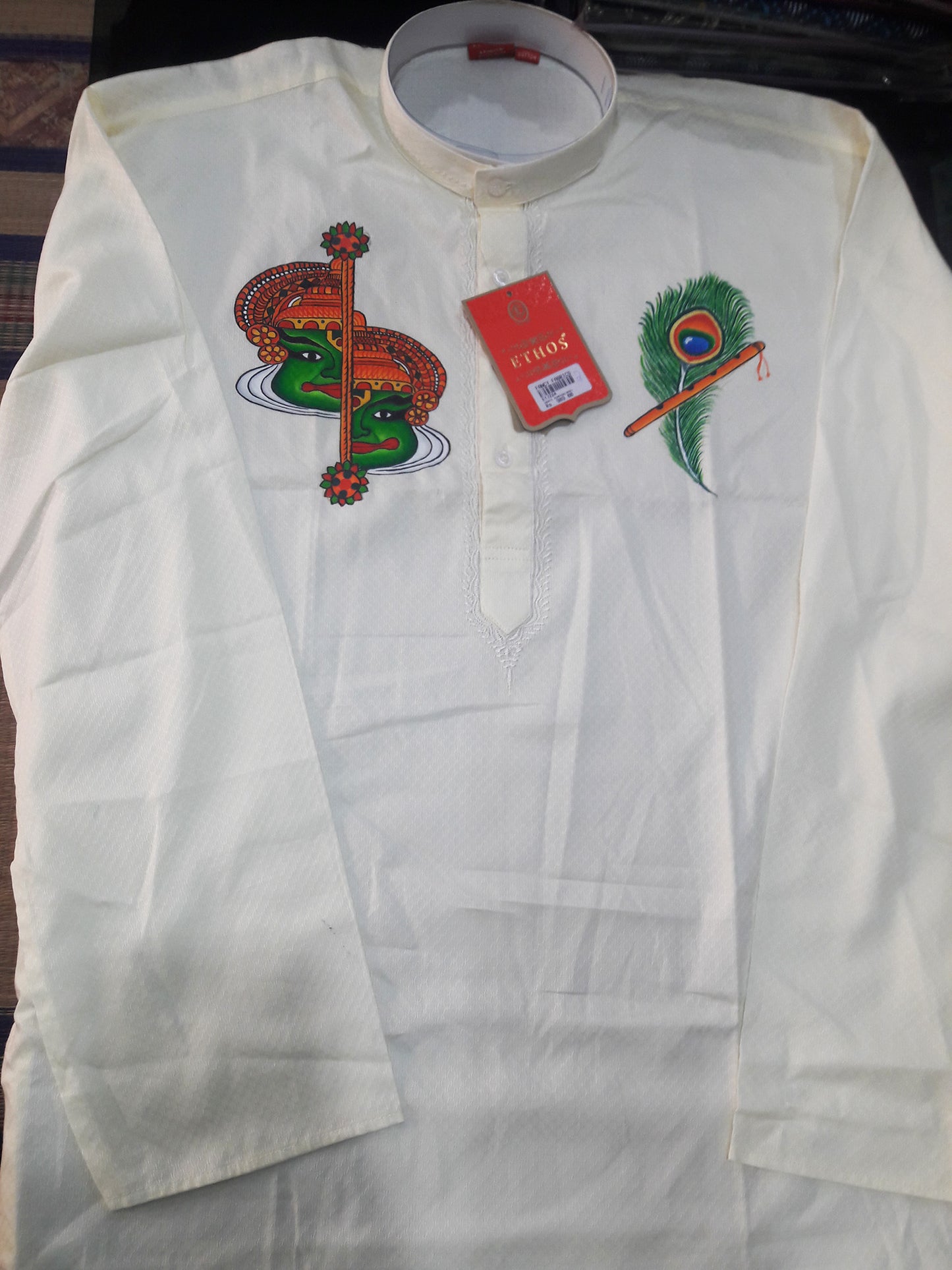 Half kathakali face with peeli hand mural painting on silk cream kurta