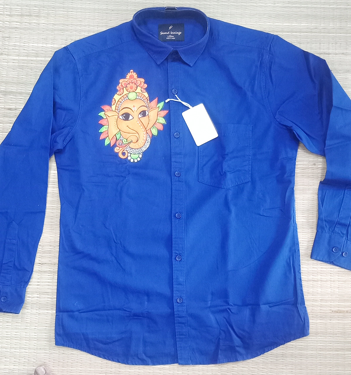 Cute Ganapathi face hand mural painting on blue shirts