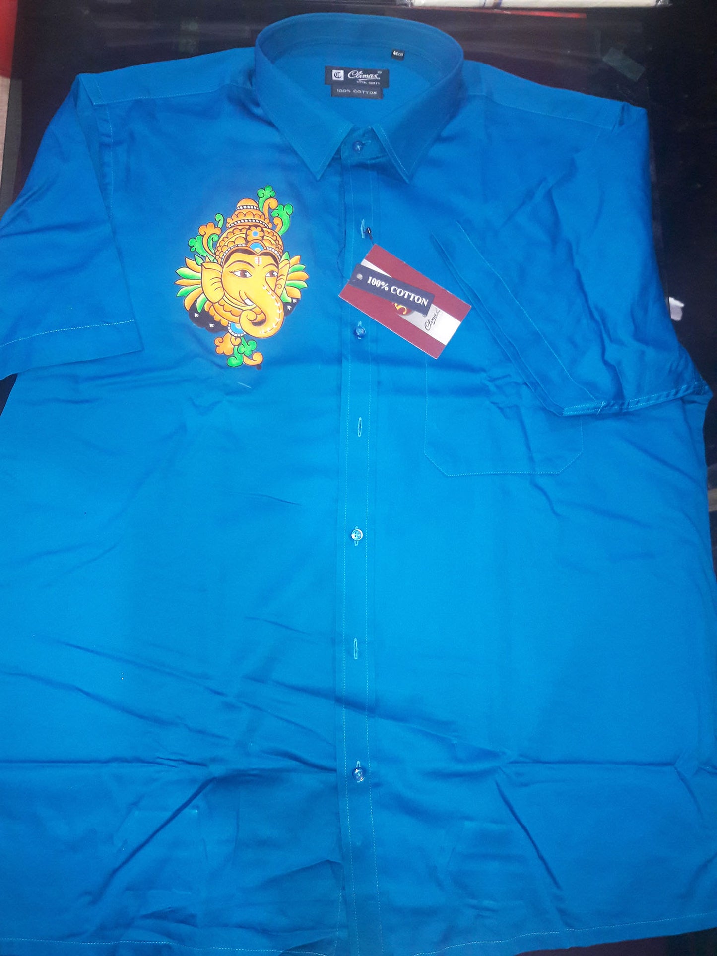 Ganapathi hand mural painting on blue cotton shirt