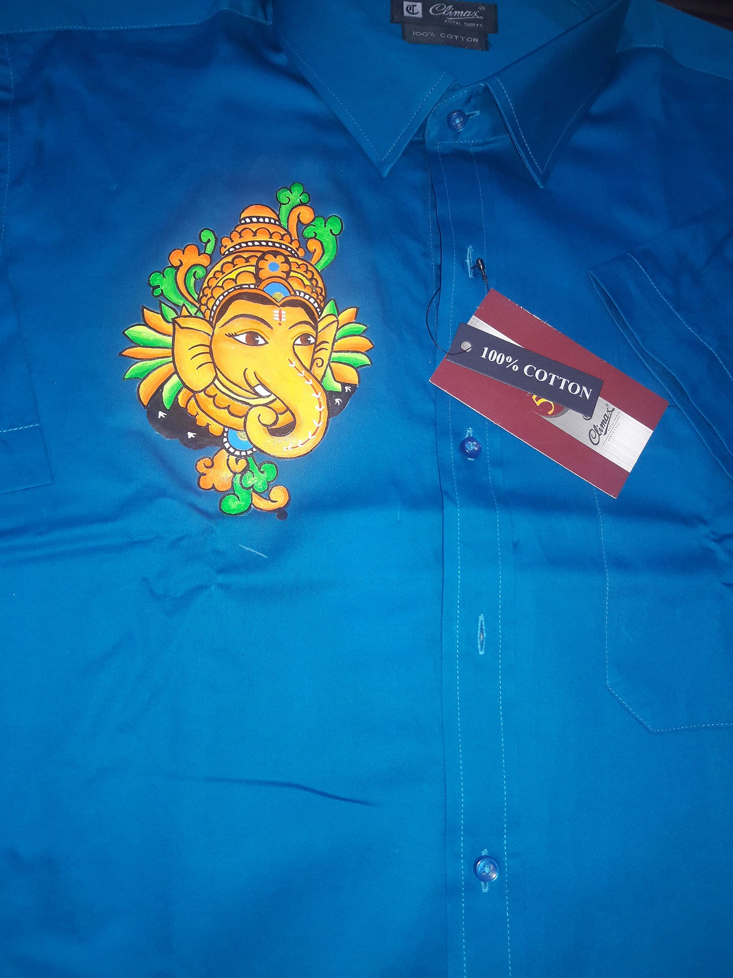 Ganapathi hand mural painting on blue cotton shirt