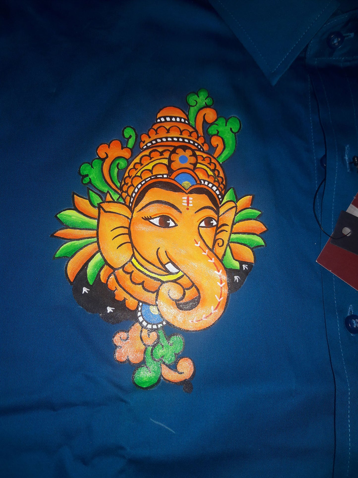 Ganapathi hand mural painting on blue cotton shirt