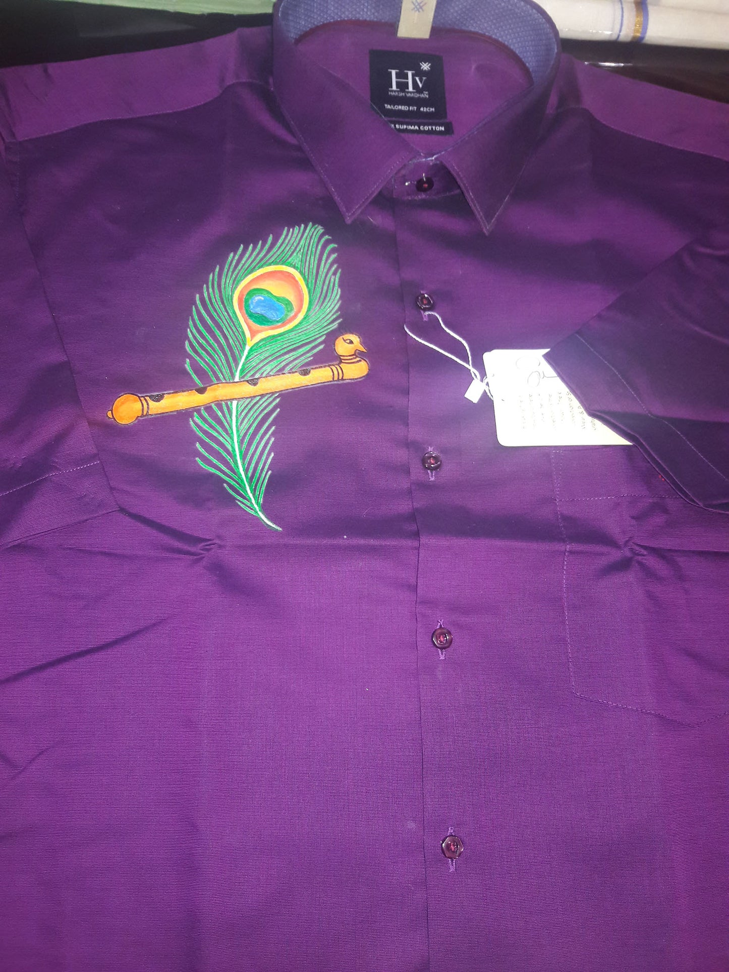 Mazhilpeeli hand mural painting on violet cotton shirt