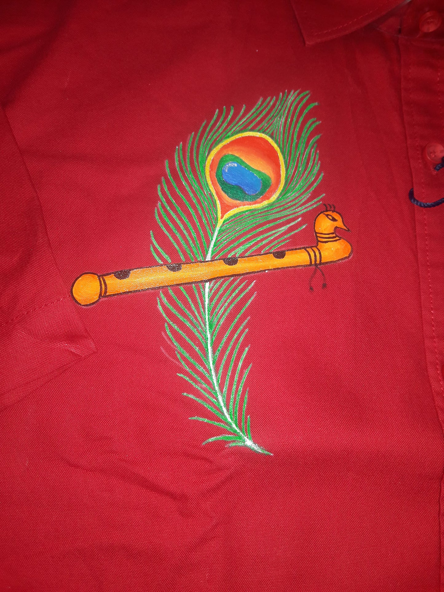 Mazhil Peeli hand mural painting on red cotton shirt