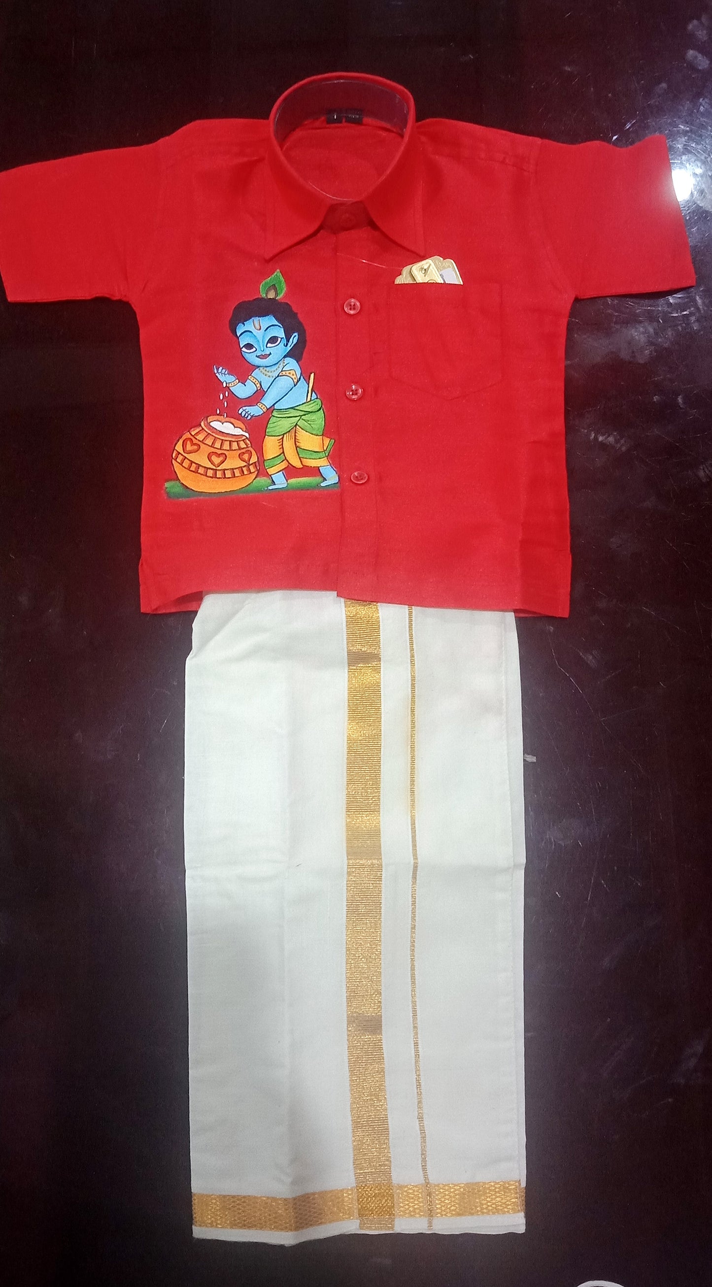 Krishna with pot hand mural painting on kids red shirt and mundu
