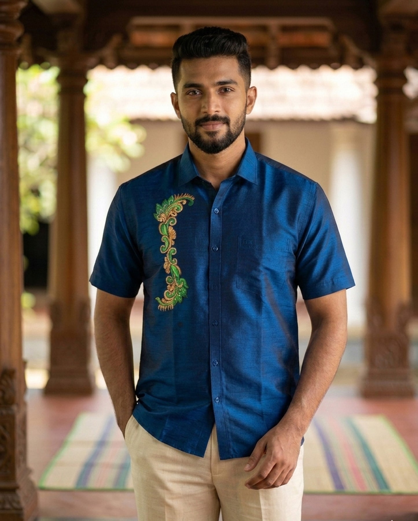 Mural design hand painting work on blue cotton shirt
