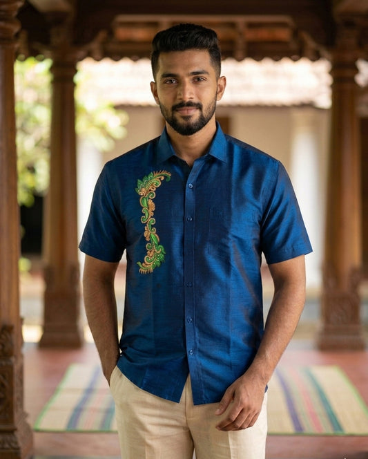 Mural design hand painting work on blue cotton shirt