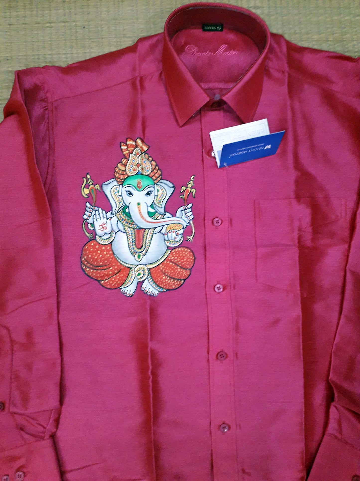 White ganapathy hand mural painting on pink silk shirt