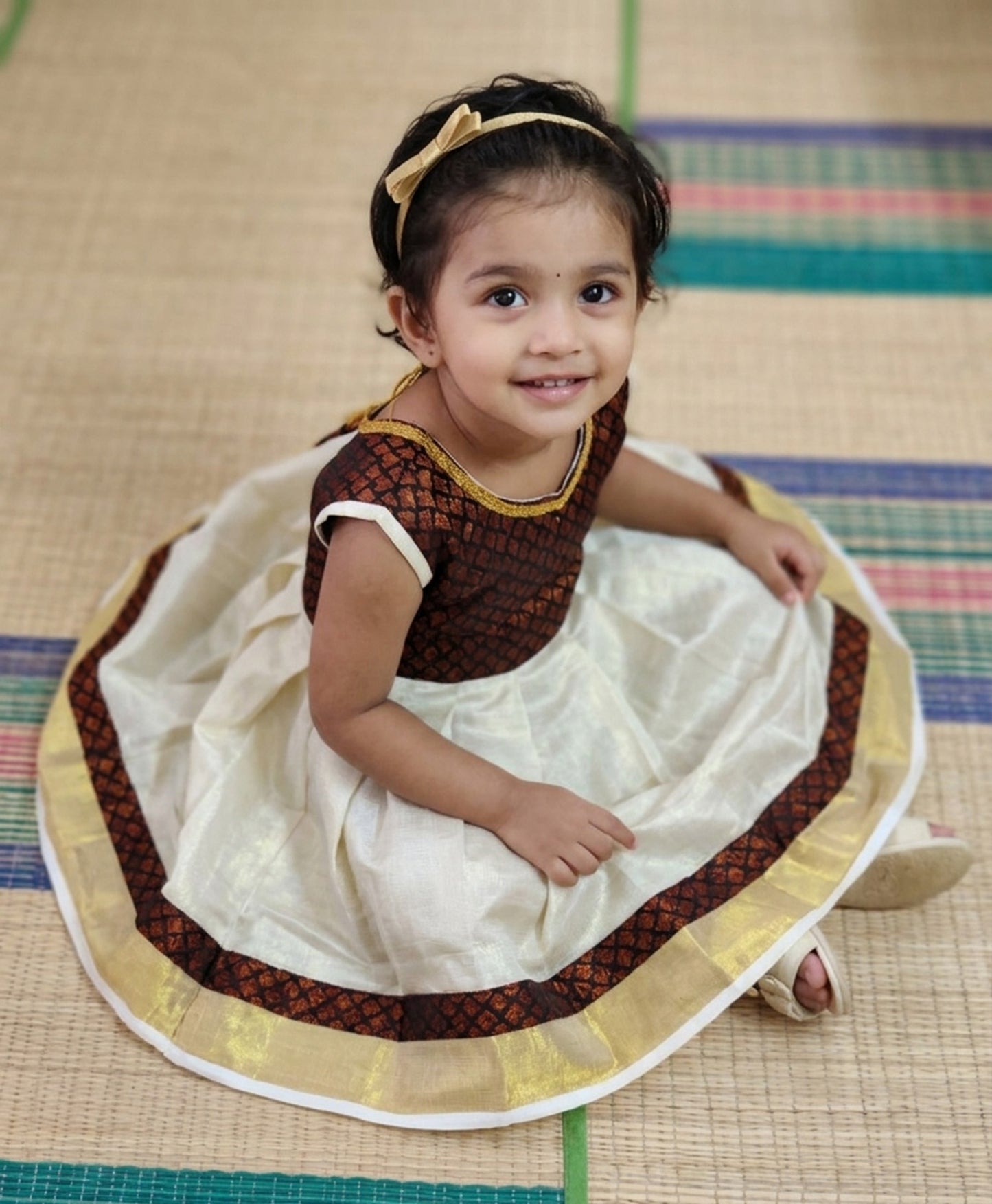 Designer traditional kerala tissue kasavu frock for kids