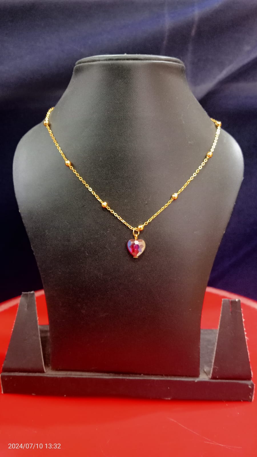 Golden alloy necklace with stylish heart stone for women traditional wear