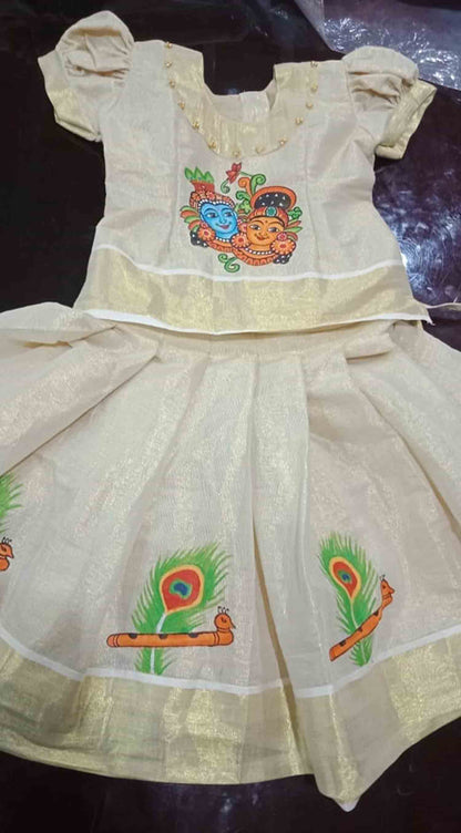 Kerala tissue pattu pavada with krishna radha mural painting for girls