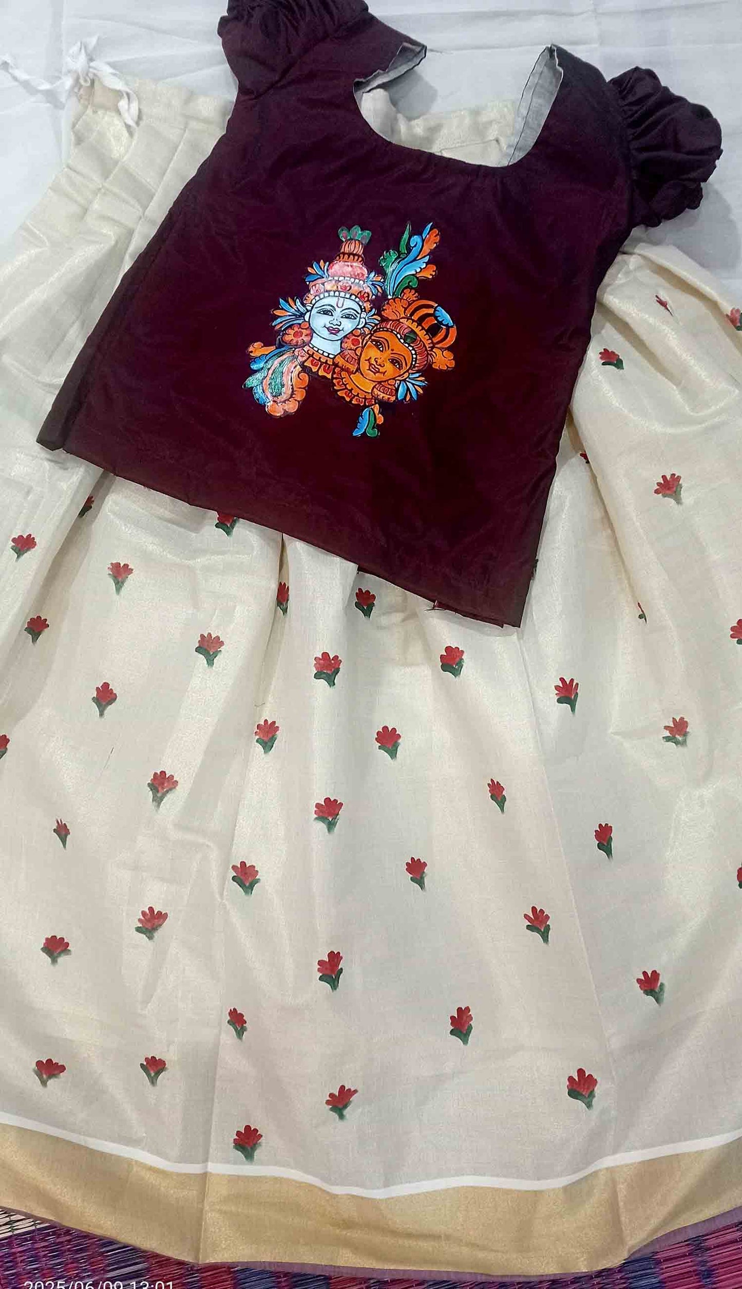 Radha krishna design on top and flower design on kasavu pavada