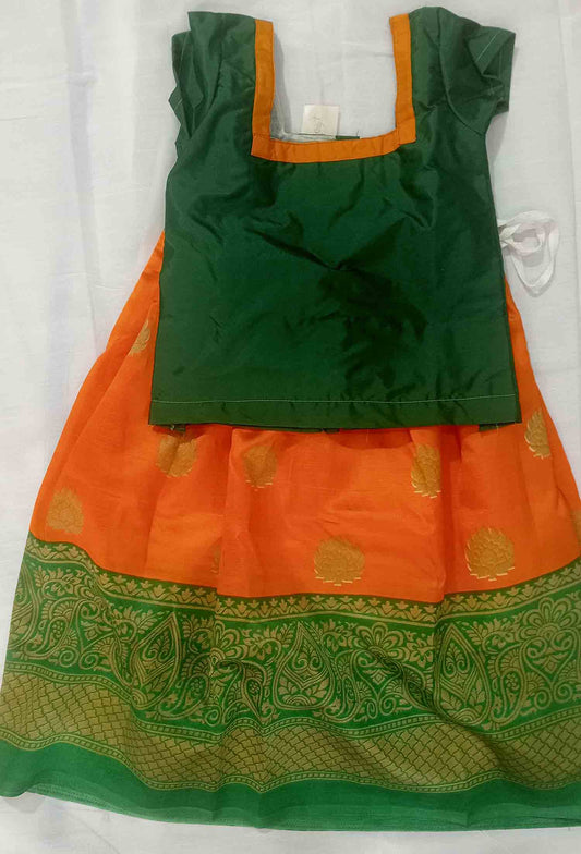 Orange colour pattu pavada with green blouse