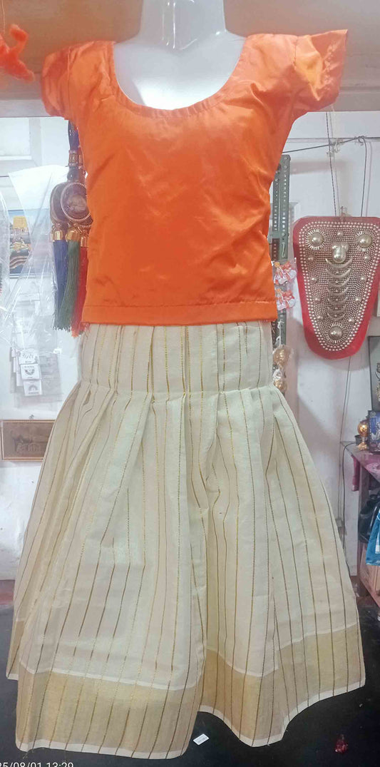 Line design kerala tissue kasavu pattu pavada with orange blouse