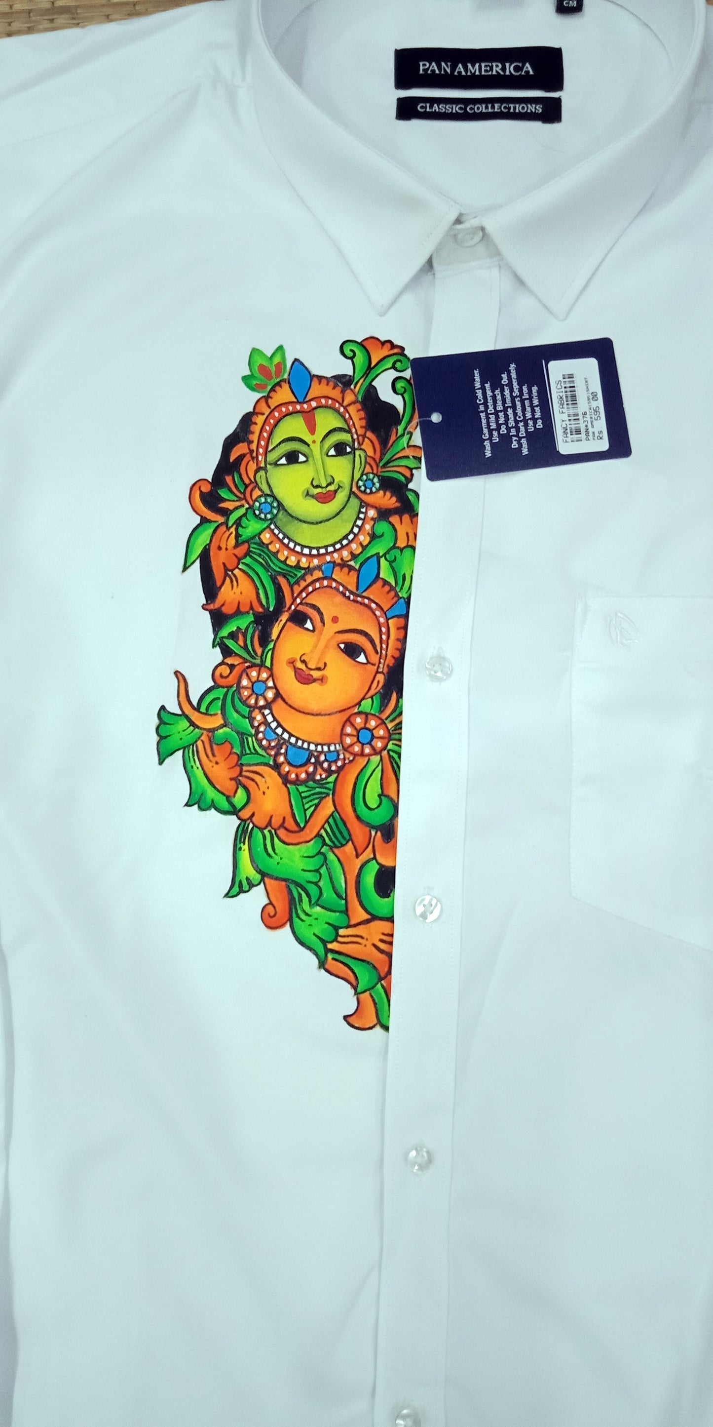 green krishna radha downwards hand mural painting on white shirt